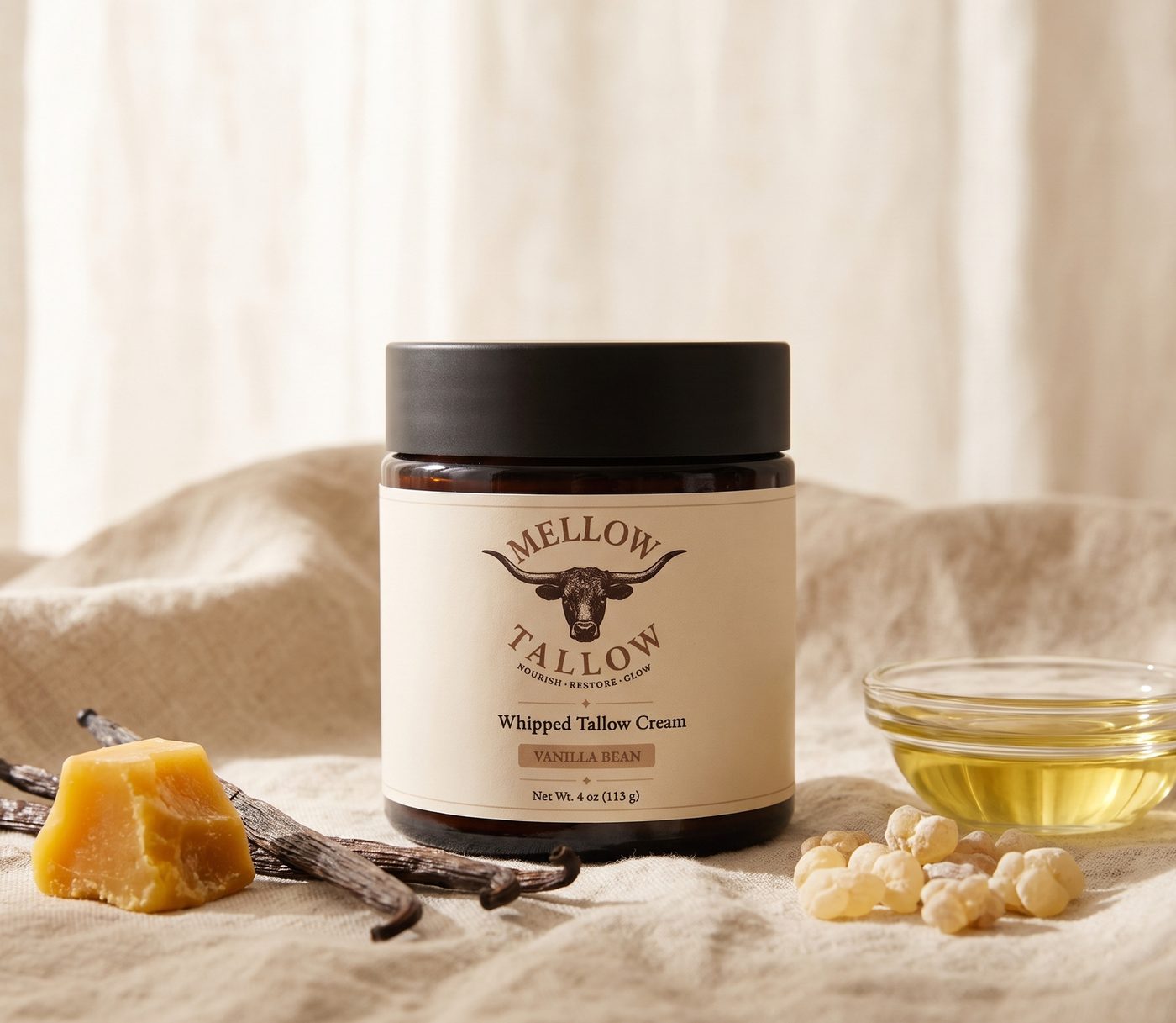Mellow Tallow Whipped Tallow Cream in vanilla bean on linen, with vanilla pods, beeswax, frankincense resin and a dish of oil